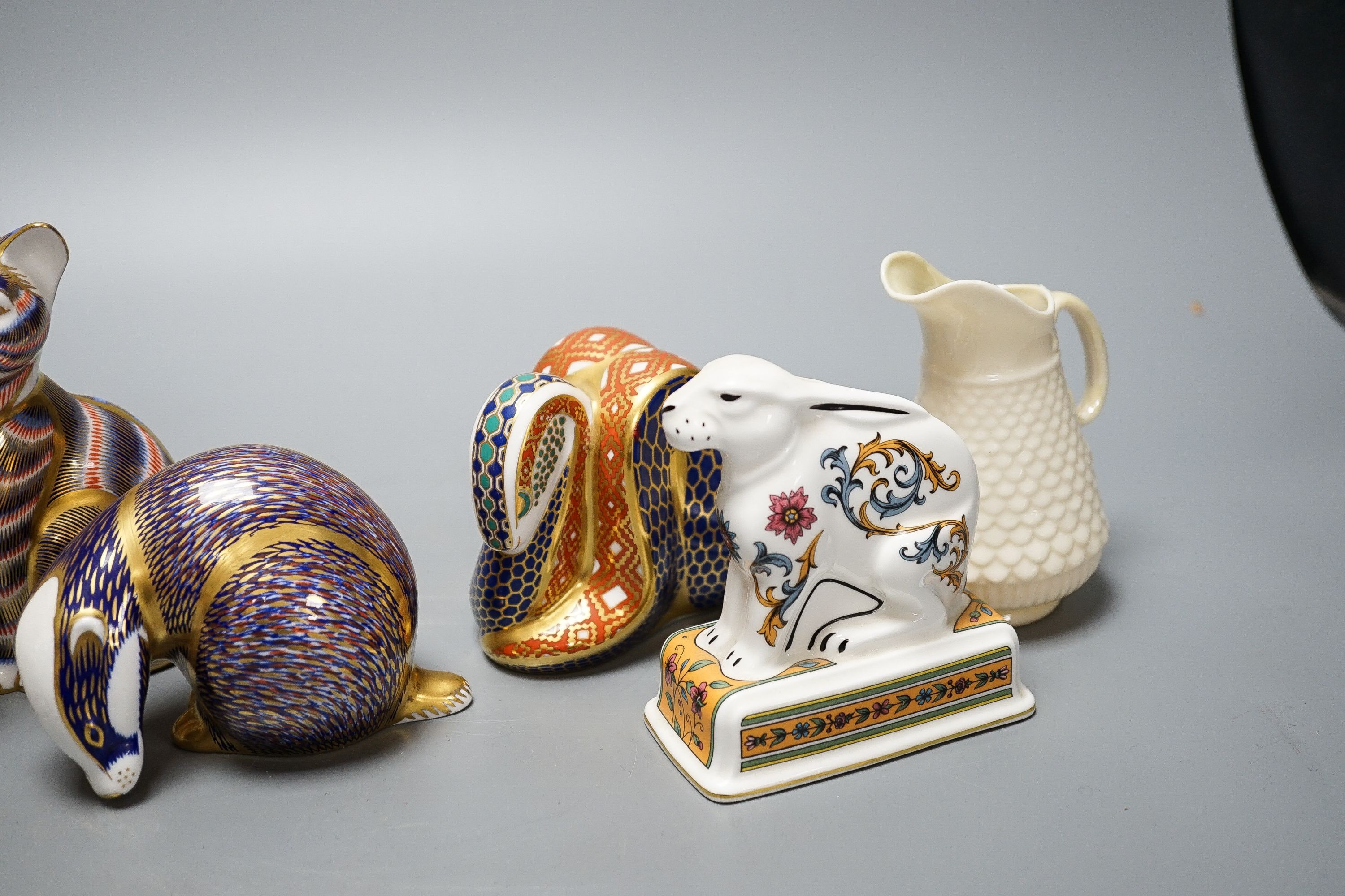 Four Royal Crown Derby paperweights, a Royal Doulton jug, a Belleek jug and a Wedgwood Noah’s ark collection hare